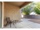 Covered patio with a chair and a small table, perfect for outdoor seating at 337 N 103Rd Pl, Apache Junction, AZ 85120