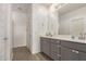 En-suite bathroom shows a large vanity and a view of the walk-in shower at 343 S 202Nd Dr, Buckeye, AZ 85326