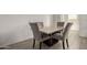 Cozy dining area with seating for four and a marble table at 343 S 202Nd Dr, Buckeye, AZ 85326