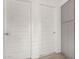 Hallway shows two, five-panel doors and built-in cabinets at 343 S 202Nd Dr, Buckeye, AZ 85326