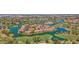 Stunning aerial view of lakeside homes on a lush golf course community, offering serene waterfront living at 3800 S Cantabria Cir # 1077, Chandler, AZ 85248