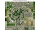 An aerial view of a meticulously planned community, golf course, and surrounding landscapes, showing an organized layout at 3800 S Cantabria Cir # 1077, Chandler, AZ 85248