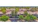 Aerial view of a neighborhood of townhomes with mature trees and well-kept landscaping at 3800 S Cantabria Cir # 1077, Chandler, AZ 85248