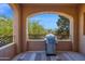 Balcony area with barbeque grill overlooking lush green trees at 3800 S Cantabria Cir # 1077, Chandler, AZ 85248