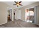 Neutral bedroom with ceiling fan, and sliding doors to a balcony at 3800 S Cantabria Cir # 1077, Chandler, AZ 85248