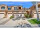 Charming townhome showcasing a well-maintained garage, driveway, and landscaped front yard at 3800 S Cantabria Cir # 1077, Chandler, AZ 85248