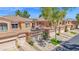 Three townhomes with desert landscaping, multi-car garages, and barrel tile roofs at 3800 S Cantabria Cir # 1077, Chandler, AZ 85248