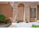 Charming front door exterior with potted plants, stone walkway, and neutral-toned facade at 3800 S Cantabria Cir # 1077, Chandler, AZ 85248