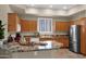 Bright and airy kitchen with stainless steel appliances, granite counters and eat in island at 3800 S Cantabria Cir # 1077, Chandler, AZ 85248