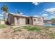 Expansive backyard featuring a refreshing pool and a well-maintained block fence for added privacy and security at 408 N Falcon Ct, Gilbert, AZ 85234