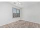 Bedroom featuring neutral carpet, window with blinds, and electrical outlets at 408 N Falcon Ct, Gilbert, AZ 85234