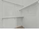 Spacious walk-in closet features ample shelving and storage for clothing and accessories at 408 N Falcon Ct, Gilbert, AZ 85234