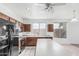 Bright kitchen featuring tile floors, an island, and stainless steel appliances at 408 N Falcon Ct, Gilbert, AZ 85234