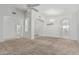 Bright living room with ceiling fan and tile flooring near the entryway at 408 N Falcon Ct, Gilbert, AZ 85234