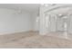 Spacious, light-filled living room with neutral-toned walls and carpet flooring at 408 N Falcon Ct, Gilbert, AZ 85234