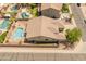 Overhead shot of a residence with a private backyard pool, desert landscaping, and a peaceful residential neighborhood setting at 44574 W High Desert Trl, Maricopa, AZ 85139