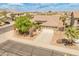 Aerial view of a single-Gathering home with a two-car garage, desert landscaping, and a well-maintained front yard at 44574 W High Desert Trl, Maricopa, AZ 85139