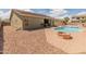 View of backyard, showcasing a pool, brick patio and desert landscaping at 44574 W High Desert Trl, Maricopa, AZ 85139