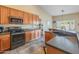 Well-equipped kitchen with modern appliances, generous countertop space, and stylish cabinetry at 44574 W High Desert Trl, Maricopa, AZ 85139