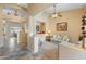 Cozy living room with neutral tones, a ceiling fan, and an open layout, perfect for relaxation and entertaining guests at 44574 W High Desert Trl, Maricopa, AZ 85139
