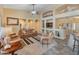 Spacious living room with a ceiling fan, comfortable seating, and stylish design at 44574 W High Desert Trl, Maricopa, AZ 85139