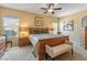 Serene bedroom with soft lighting, comfortable furnishings, and a tranquil ambiance at 44574 W High Desert Trl, Maricopa, AZ 85139