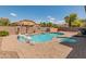 Private pool and spa surrounded by a beautifully landscaped yard with ample seating and lounge areas at 44574 W High Desert Trl, Maricopa, AZ 85139