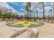 Community splash pad with chairs and desert landscaping at 44574 W High Desert Trl, Maricopa, AZ 85139
