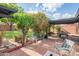 Inviting brick patio featuring a pergola, lush greenery, and comfortable seating, perfect for outdoor entertaining at 4502 N 17Th Ave, Phoenix, AZ 85015