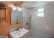 Stylish bathroom featuring a scallop tiled wall, brass fixtures, and modern vanity at 4502 N 17Th Ave, Phoenix, AZ 85015
