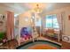 Charming bedroom with a loft bed, desk, and colorful décor at 4502 N 17Th Ave, Phoenix, AZ 85015