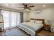 Inviting bedroom with a ceiling fan, wooden bed frame, and stylish décor at 4502 N 17Th Ave, Phoenix, AZ 85015
