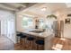 Modern kitchen featuring stainless steel appliances, granite countertops, and a breakfast bar with seating for casual dining at 4502 N 17Th Ave, Phoenix, AZ 85015