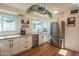 Bright kitchen featuring stainless steel appliances, white cabinets, and ample counter space for meal preparation at 4502 N 17Th Ave, Phoenix, AZ 85015