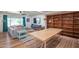 Spacious living room with a large built-in bookcase, plush sofa, and wood floors at 4502 N 17Th Ave, Phoenix, AZ 85015