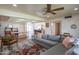 Spacious living room with a large sectional sofa, patterned rug, and open access to the kitchen and dining area at 4502 N 17Th Ave, Phoenix, AZ 85015