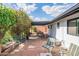 Inviting brick patio with comfortable seating under a covered pergola, perfect for outdoor entertaining at 4502 N 17Th Ave, Phoenix, AZ 85015