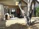 Back patio featuring a heater, bird feeder and cage, and a mature tree providing shade at 4601 W Fortune Dr, Anthem, AZ 85086