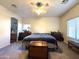 Spacious bedroom with neutral tones, carpeted floors, a ceiling fan, and natural light at 4601 W Fortune Dr, Anthem, AZ 85086