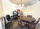 Dining room featuring a wooden table with patterned chairs, a chandelier, and unique decor at 4601 W Fortune Dr, Anthem, AZ 85086