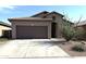 Beautiful single Gathering home features a two car garage and drought resistant landscaping at 4601 W Fortune Dr, Anthem, AZ 85086