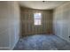 Unfinished bedroom with bare drywall and window, offering a blank canvas for customization at 46887 W Old Timer Rd, Maricopa, AZ 85139