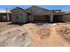 Home under construction with scaffolding, showcasing the building's structure and progress at 46887 W Old Timer Rd, Maricopa, AZ 85139