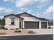 Charming single-story home with a three-car garage and low-maintenance desert landscaping at 46887 W Old Timer Rd, Maricopa, AZ 85139