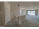 Unfinished living room with drywall and sliding glass doors leading to outdoor at 46887 W Old Timer Rd, Maricopa, AZ 85139