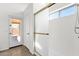 Bathroom featuring a shower with sliding glass doors and access to the backyard at 4723 W Samantha Way, Laveen, AZ 85339