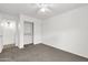 Bedroom featuring carpeting, ceiling fan and closet with sliding doors for ample storage at 4723 W Samantha Way, Laveen, AZ 85339