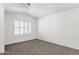 A bright bedroom features neutral walls, carpet floors, and shuttered windows at 4723 W Samantha Way, Laveen, AZ 85339