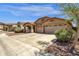 Charming single-story home with a well-maintained lawn and a spacious three car driveway at 4723 W Samantha Way, Laveen, AZ 85339