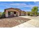 Charming single-story home with a well-maintained lawn and a spacious three car driveway at 4723 W Samantha Way, Laveen, AZ 85339